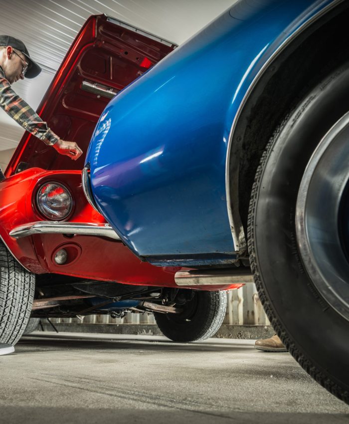 Caucasian American Classic Cars Enthusiast in His 30s Working on His Vehicle